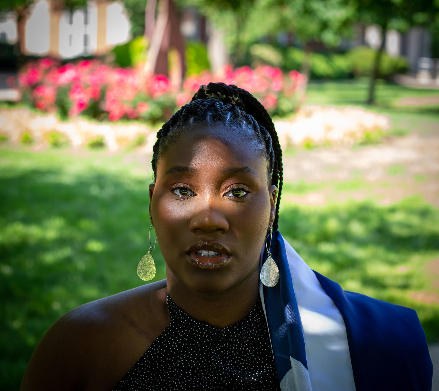 Graduate posing with diploma