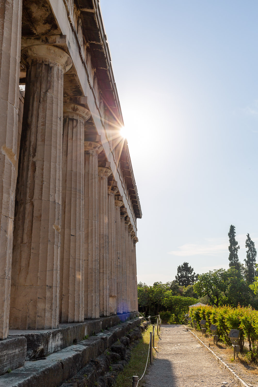 Ancient Greek columns in warm sunlight