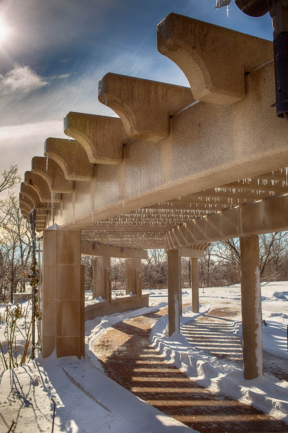 View through a stone archway revealing the landscape beyond