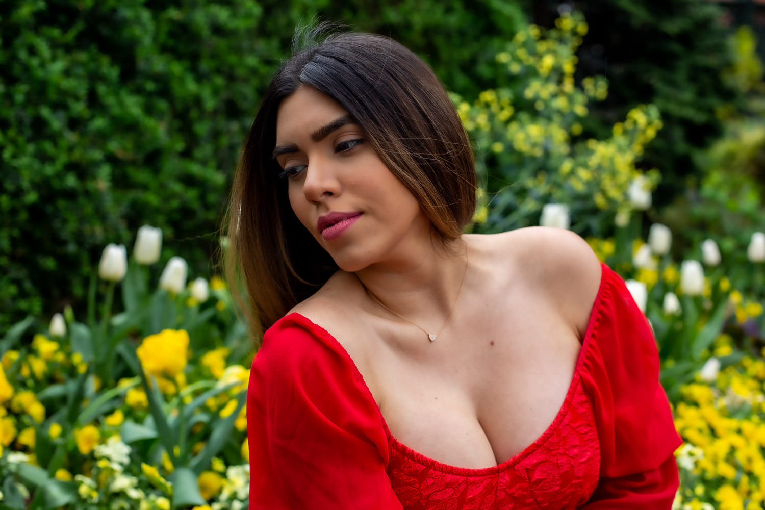 Ethvelyn Lovera among garden flowers