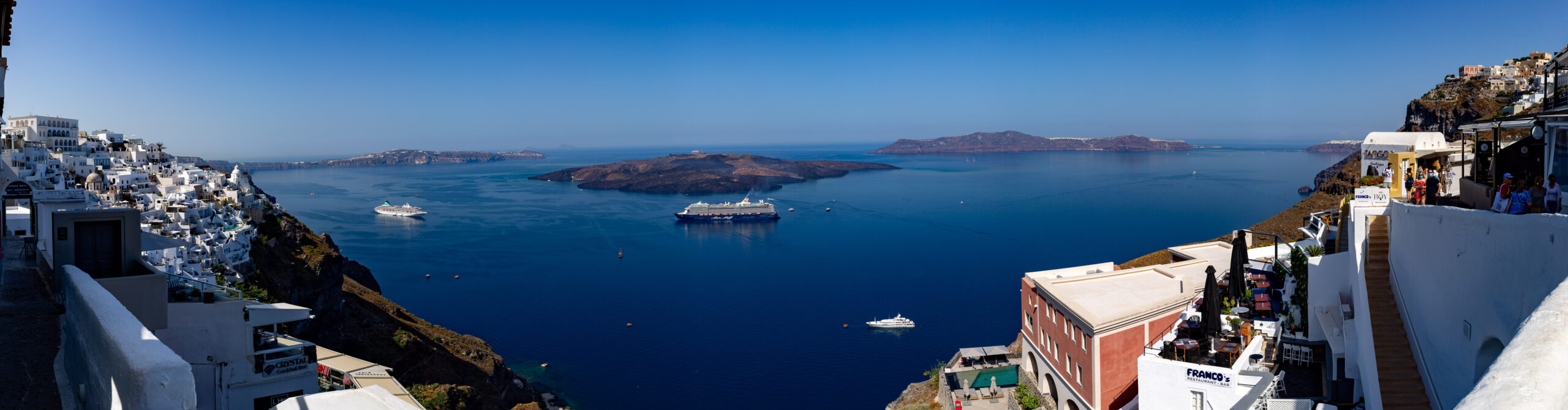 White building with blue sea in Santorini