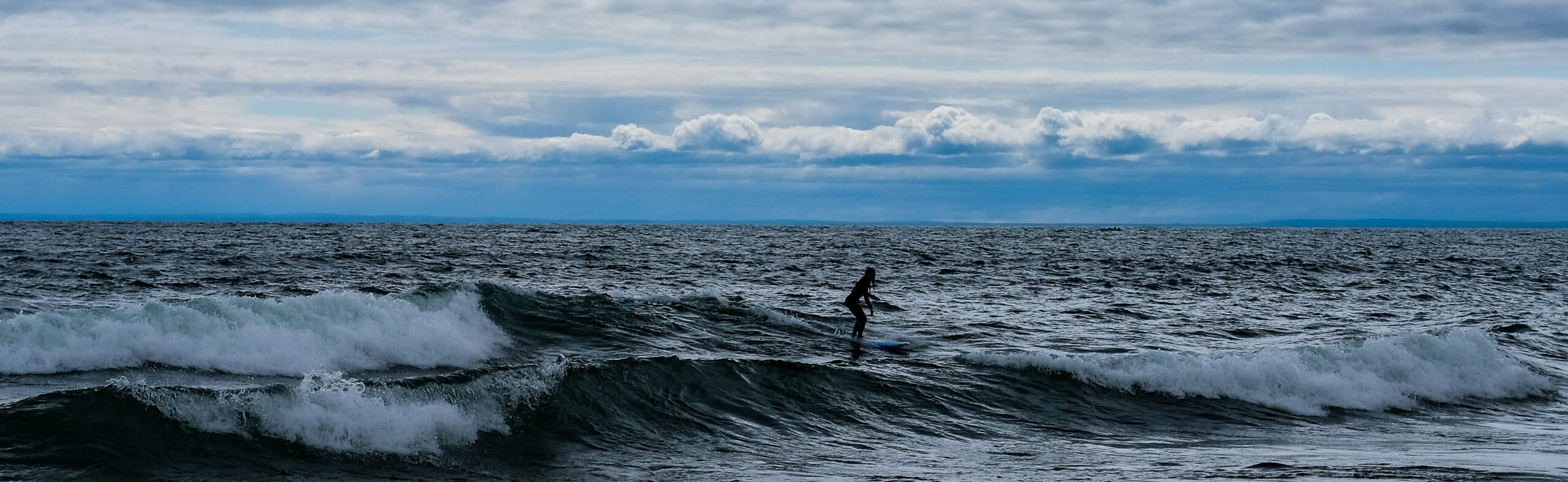 Woman surfer on Lake Superior